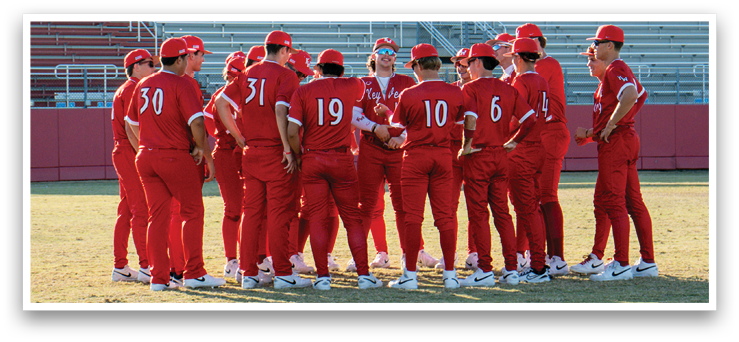 A group of baseball players wearing red uniforms and red hats are standing together on a field. AI generated content