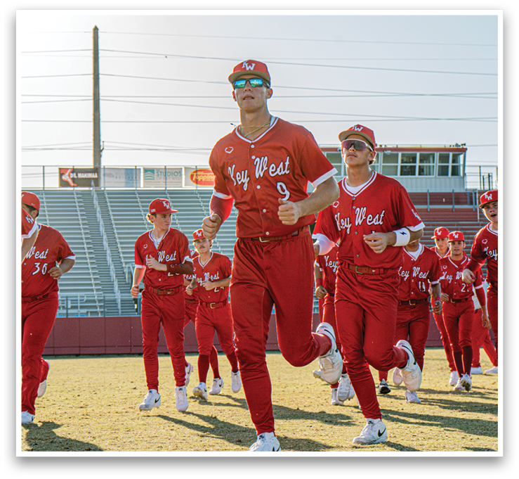 A group of people wearing red uniforms are running on a field. AI generated content