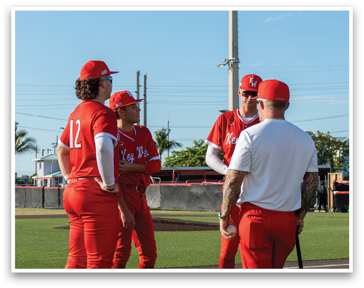 A group of men wearing red uniforms and red hats are standing on a baseball field. AI generated content