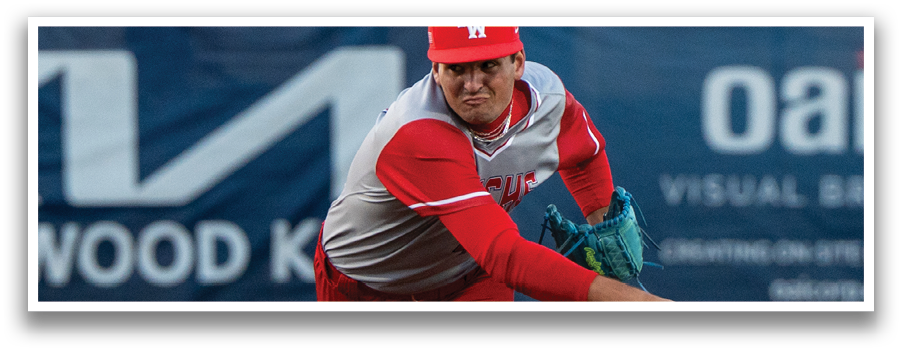 A baseball player in a red uniform is pitching a ball on a field. AI generated content