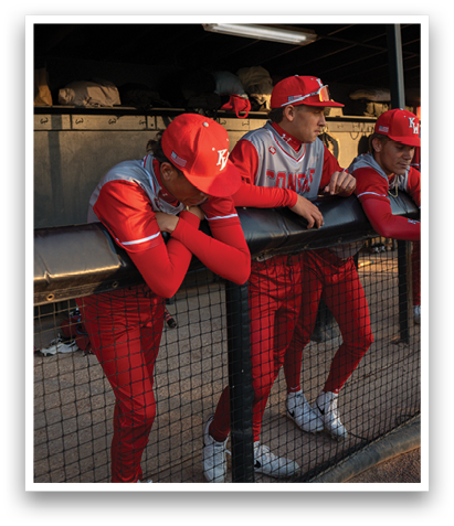 Three baseball players wearing red uniforms are leaning on a fence. AI generated content