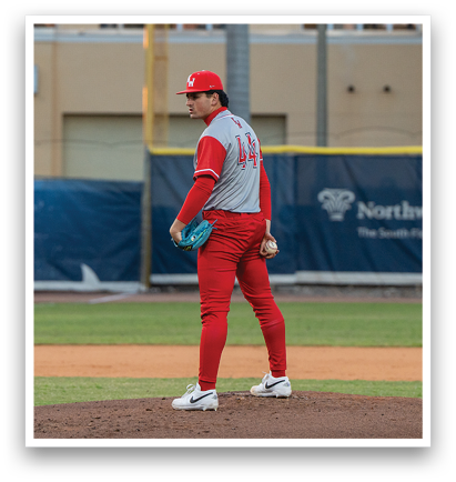 A baseball player in a red uniform stands on a pitcher's mound, holding a baseball glove. AI generated content