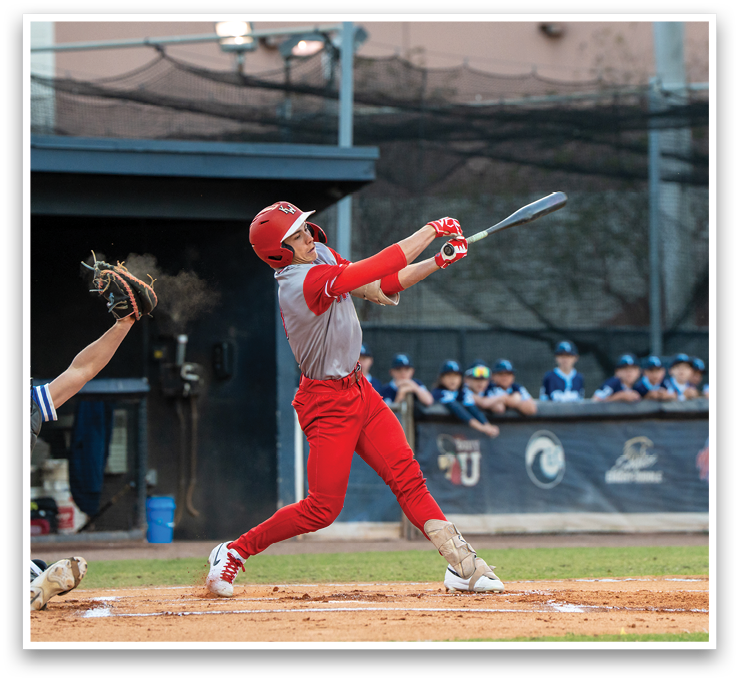 A baseball player in a red uniform swings a bat at a ball. AI generated content