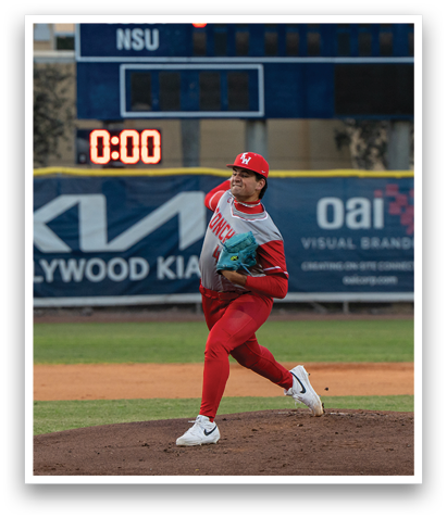 A baseball player in a red uniform is pitching a ball on a field. AI generated content