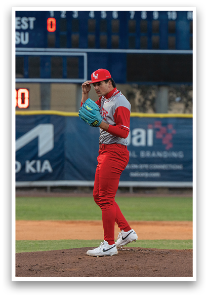 A baseball player in a red uniform is on the mound, holding a baseball in his hand. AI generated content
