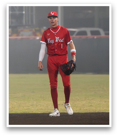 A baseball player in a red uniform is standing on the field. AI generated content