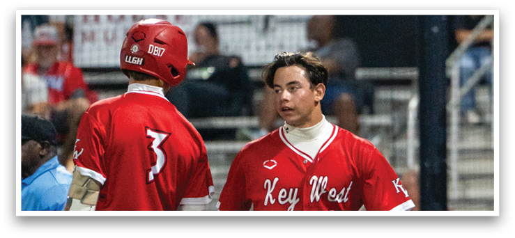 Baseball players wearing red uniforms are walking on the field. AI generated content