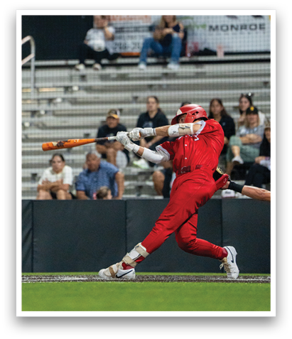 A baseball player in a red uniform is swinging a bat, attempting to hit a ball. AI generated content