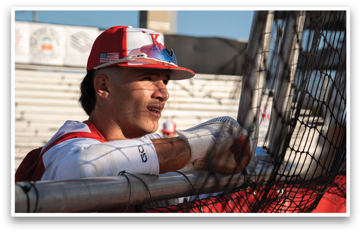 A baseball player wearing a red and white hat and sunglasses. AI generated content