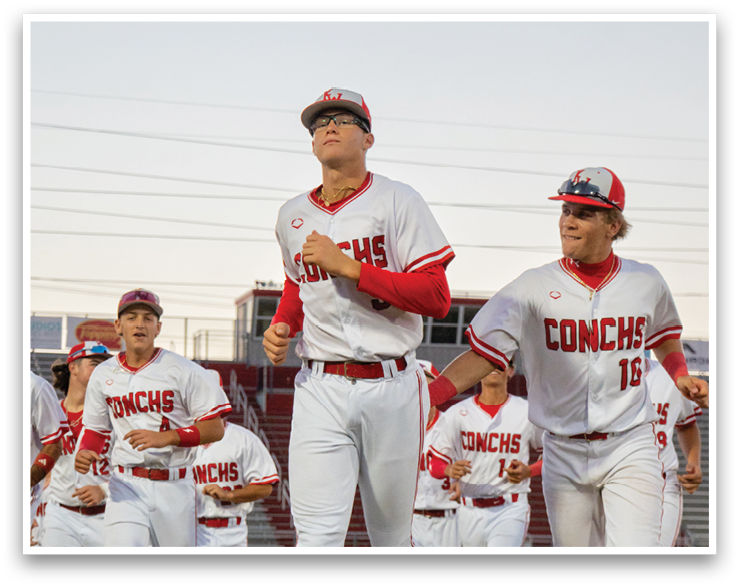 A group of baseball players wearing white uniforms are running on the field. AI generated content