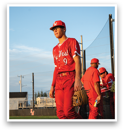 A baseball player in a red jersey walks across a field while holding a baseball glove. AI generated content