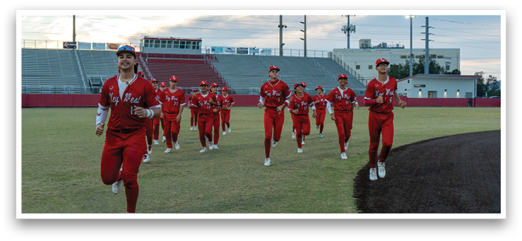 A group of people in red uniforms are walking on a field. AI generated content