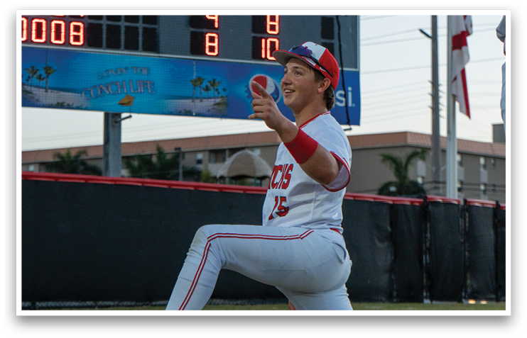 A baseball player is kneeling on the field, holding a ball in his hand. AI generated content