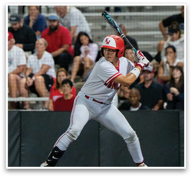 A baseball player in a red helmet and white uniform is swinging a bat, preparing to hit the ball. AI generated content