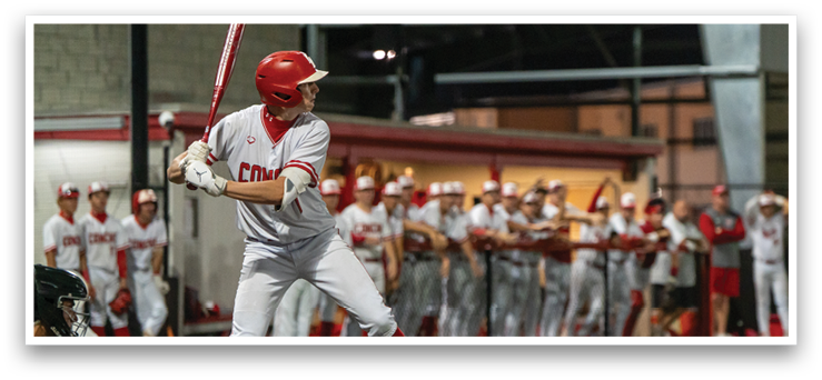 A baseball player in a white uniform is swinging a bat, preparing to hit a ball. AI generated content