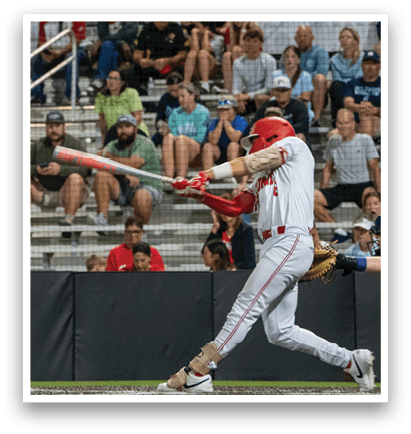 A baseball player is swinging a bat at a ball during a game. AI generated content