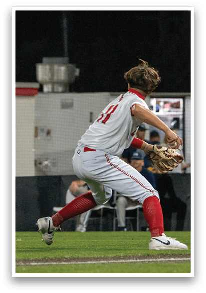 A baseball player in a white and red uniform is catching a ball. AI generated content