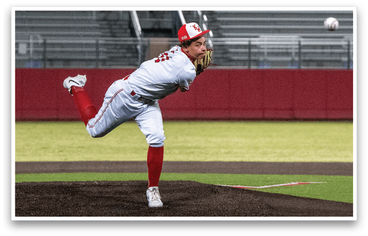 A baseball player in a white uniform is pitching a ball on a field. AI generated content