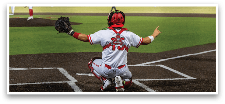 A baseball player is sitting on the ground with his arms outstretched. AI generated content