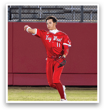A baseball player in a red uniform is throwing a ball on a field. AI generated content