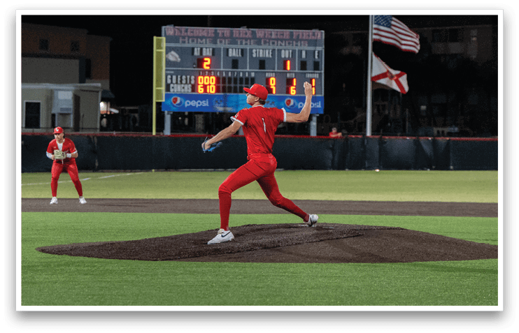 A female baseball player in a red uniform is pitching a ball on a field. AI generated content