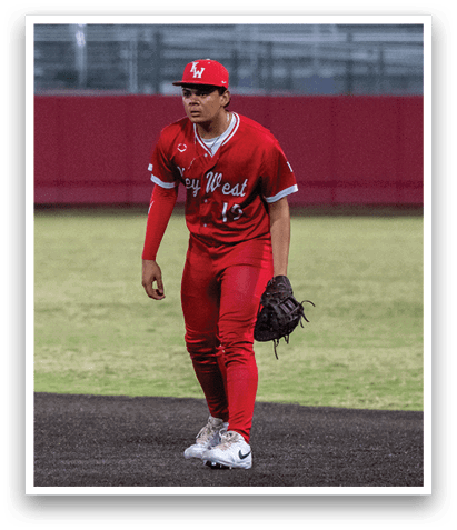 A baseball player in a red jersey and red pants is standing on the field. AI generated content