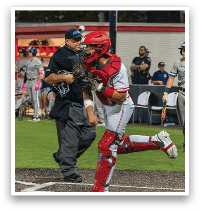 A baseball player is running towards home plate while a catcher tries to tag him out. AI generated content