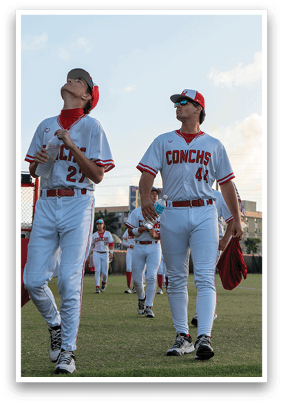 Two baseball players wearing white uniforms and red caps. AI generated content