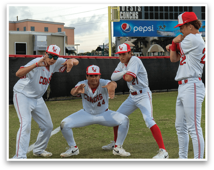 Four baseball players pose for a picture on the field. AI generated content