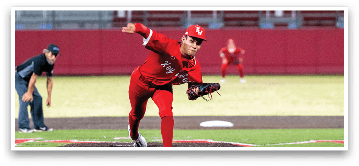 A baseball player in a red uniform is pitching a ball on a field. AI generated content