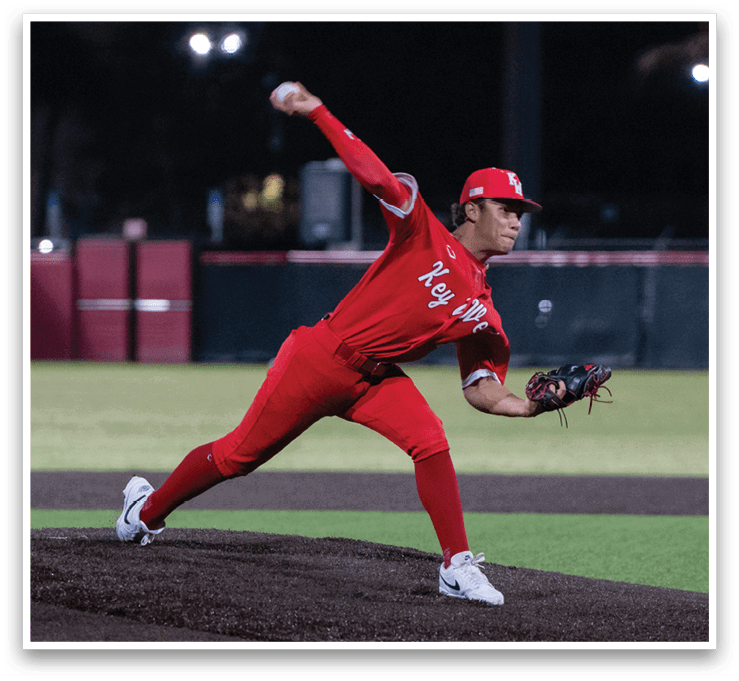 A baseball player in a red uniform is pitching a ball on a field. AI generated content