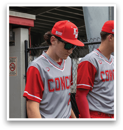 Two baseball players wearing red and grey uniforms are walking on a field. AI generated content
