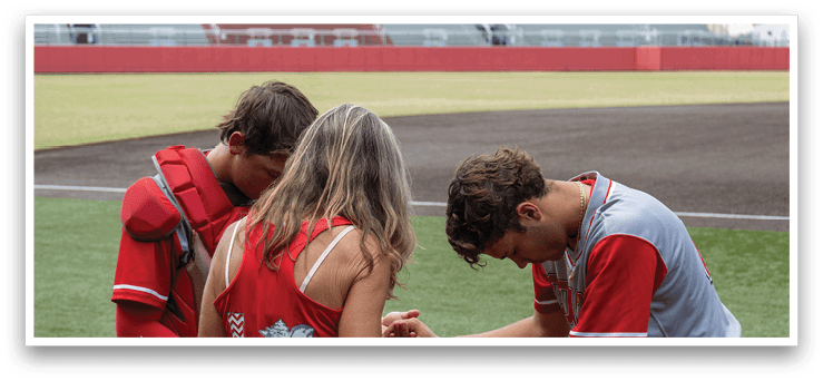 A woman and two boys are on a baseball field. The woman is bending over and touching the boys' knees. AI generated content