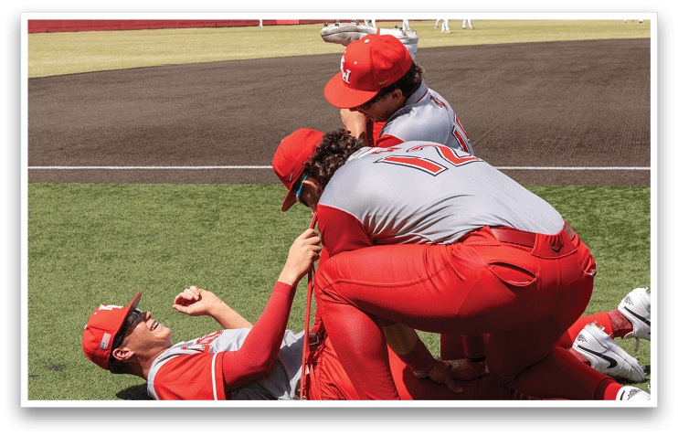 Three baseball players are hugging each other on the field. AI generated content