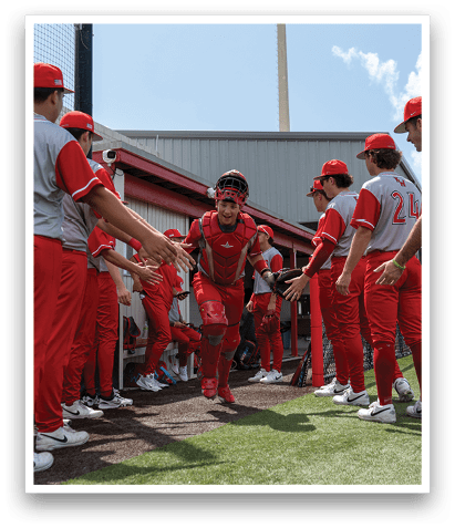 A baseball player in a red uniform is walking on the field, shaking hands with other players. AI generated content