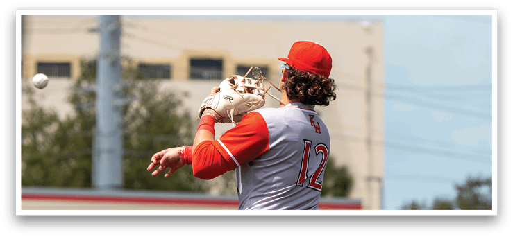 A baseball player in a red uniform is catching a ball. AI generated content