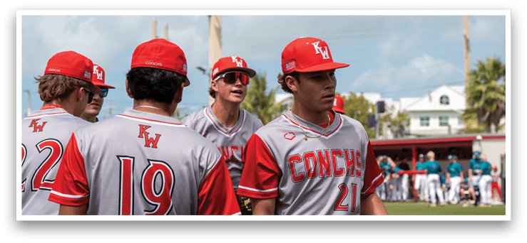 Baseball players wearing red and grey uniforms are walking on the field. AI generated content