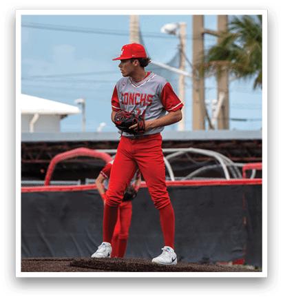 A baseball player in a red uniform stands on the pitcher's mound, holding a baseball glove. AI generated content
