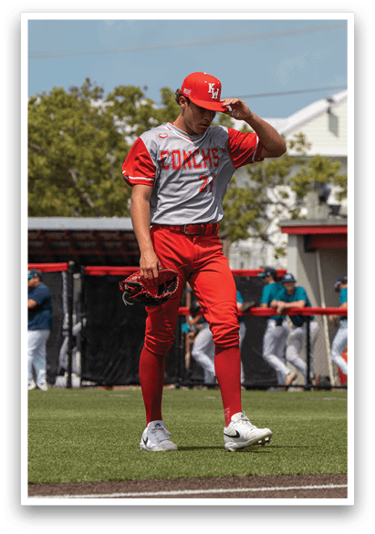 A baseball player wearing a red jersey walks across a field. AI generated content