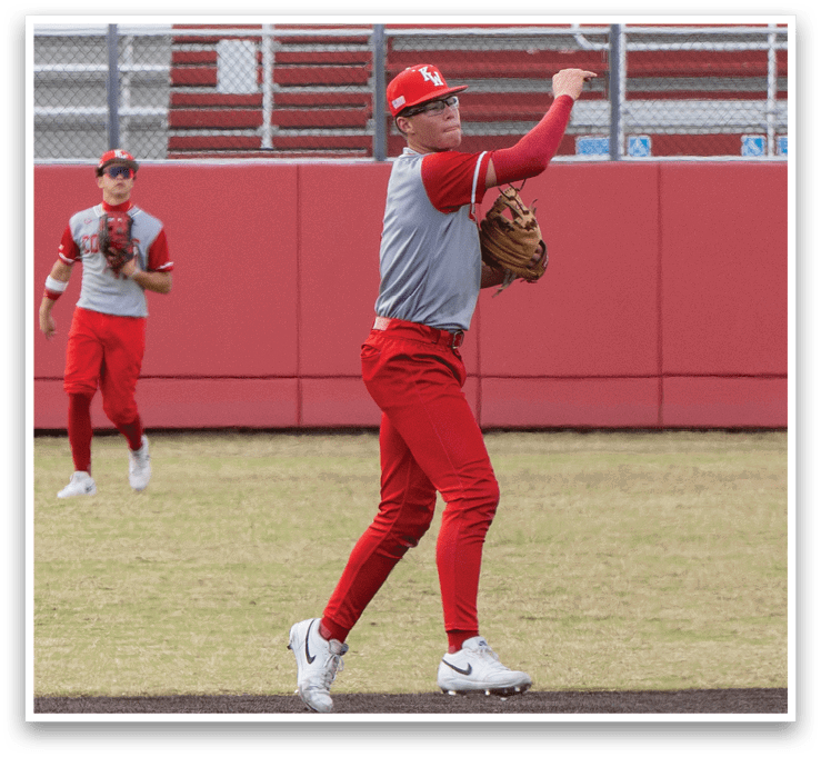 A baseball player in a red uniform is throwing a ball. AI generated content