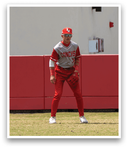 A man in a red baseball uniform is standing on a field. AI generated content