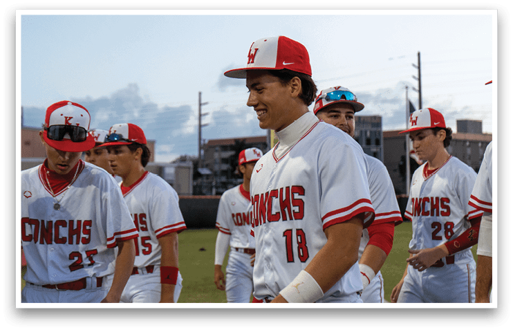 A group of baseball players wearing red and white uniforms are walking on a field. AI generated content