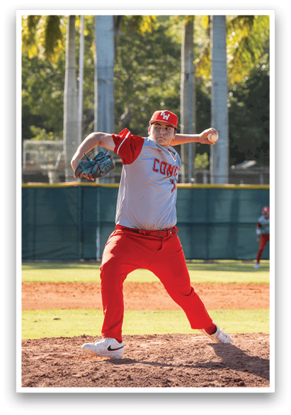 A baseball player in a red uniform is pitching a ball on a field. AI generated content