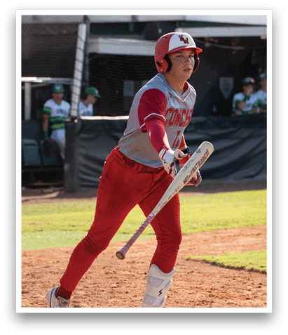 A baseball player in a red uniform is holding a bat and standing on a field. AI generated content