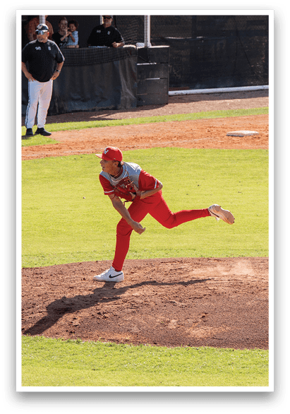 A baseball game is in progress with a pitcher throwing a ball to a batter. There are several people on the field, including a batter, a pitcher, and a catcher. The batter is holding a baseball bat, ready to swing at the incoming pitch. The scene is set on a baseball field with a dirt pitcher's mound and a grassy area. AI generated content