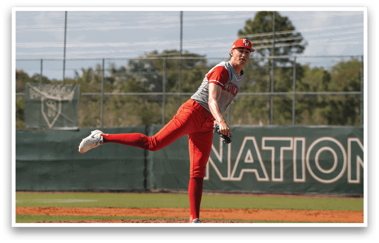 A baseball player in a red uniform is pitching a ball on a field. AI generated content