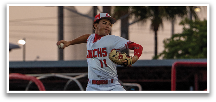 A baseball player in a white uniform is pitching a ball on a field. AI generated content