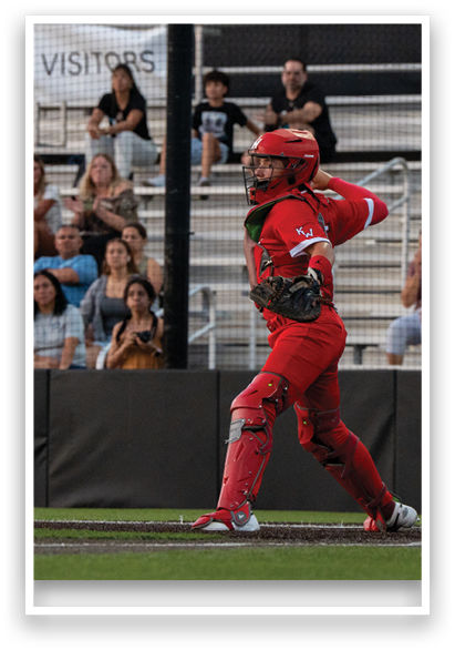 A baseball player in a red uniform is swinging a bat, preparing to hit the ball. AI generated content