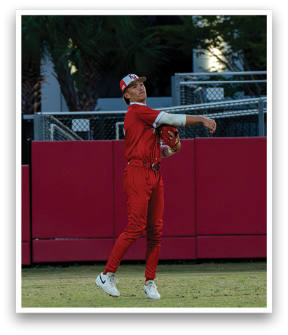 A baseball player in a red uniform is throwing a ball. AI generated content