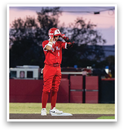 A baseball player wearing a red jersey and a red hat stands on the field. AI generated content